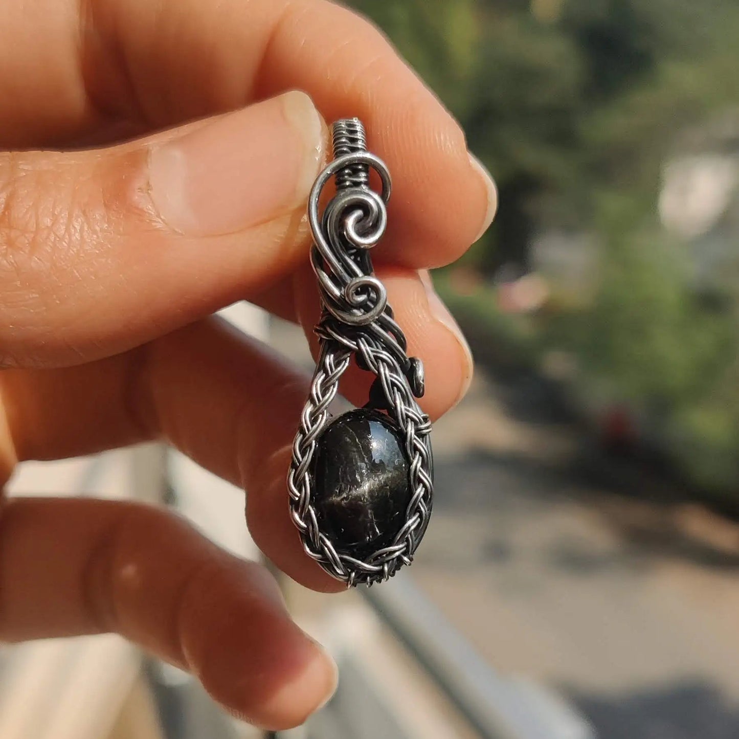 Hiya Black Star Diopside Sterling silver pendant with silver star like asterisk created by sanguine aura handcrafted crystal jewellery, India. Star diopside is known for it's trauma healing benefits and emotional healing and natural evil eye protection