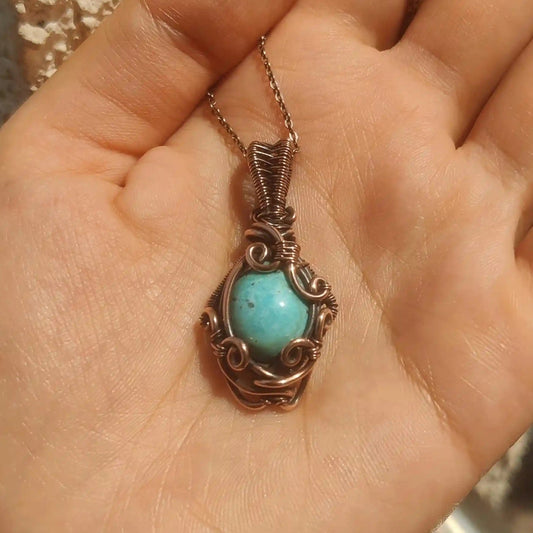 tara, a natural irani firoza pendant in copper made by sanguine aura handcrafted jewellery, India.