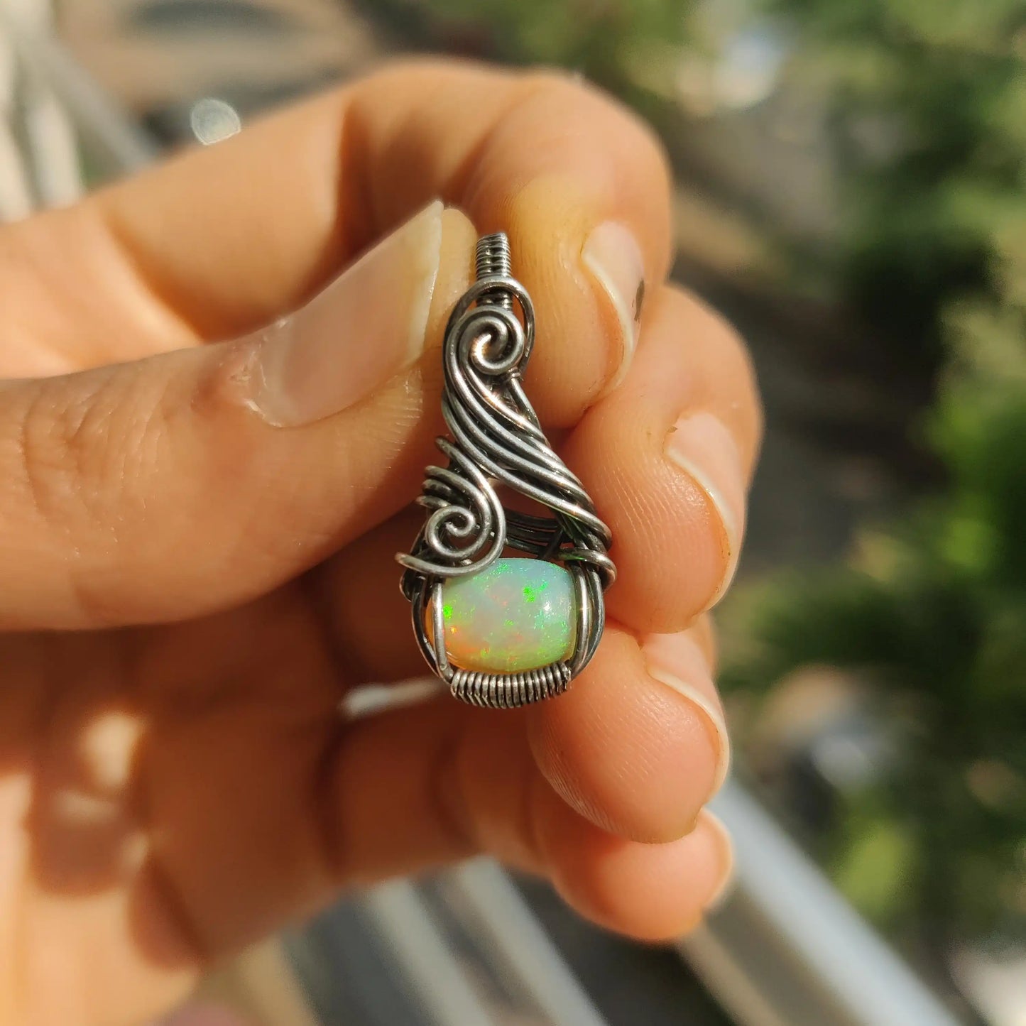 Ethiopian opal fire captured in sunlight of Banno- opal silver pendant made by sanguine aura handcrafted jewelry, India
