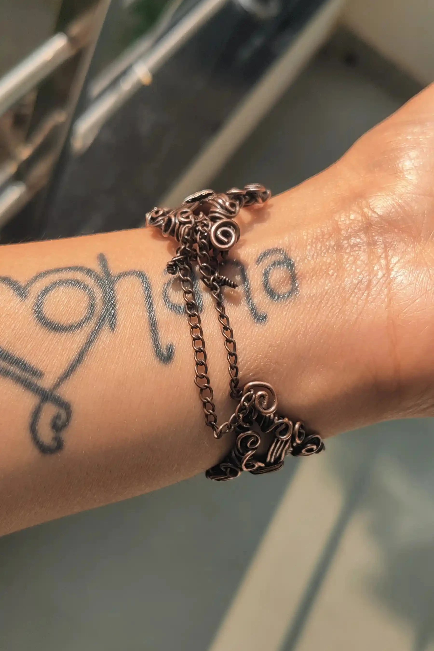 the back side of srestha, pure oxidized copper multilayered cuff bracelet handmade for spiritual and health benefits, for men and women