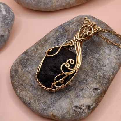 Aadhya raw tektite locket 002 in brass by sanguine aura made with whole tektite to protect against negative energy.