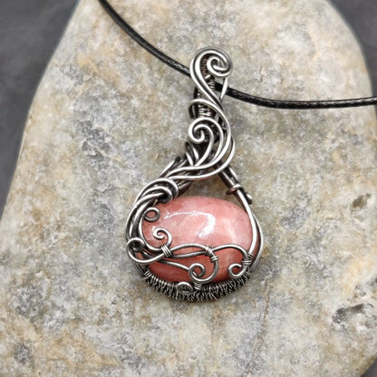 Aarunya pink stone Rhodochrosite silver pendant with black cord, handmade by local artisan for hours.