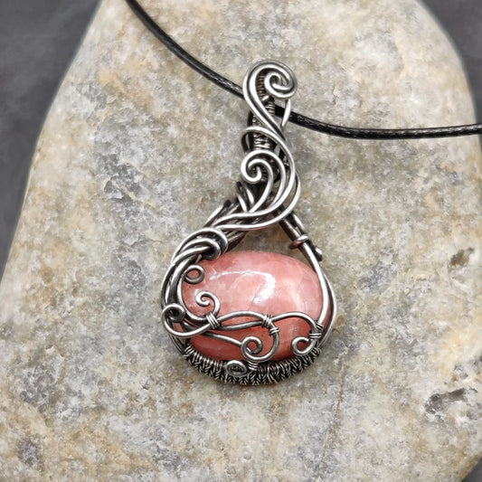 Aarunya pink stone Rhodochrosite silver pendant with black cord, handmade by local artisan for hours.