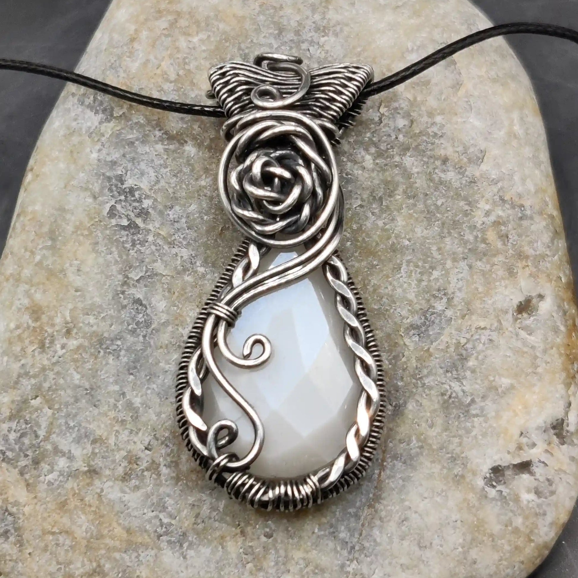 Bodhi white moonstone sterling silver pendant with fine detailing all over the pendant.