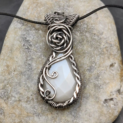 Bodhi white moonstone sterling silver pendant with fine detailing all over the pendant.