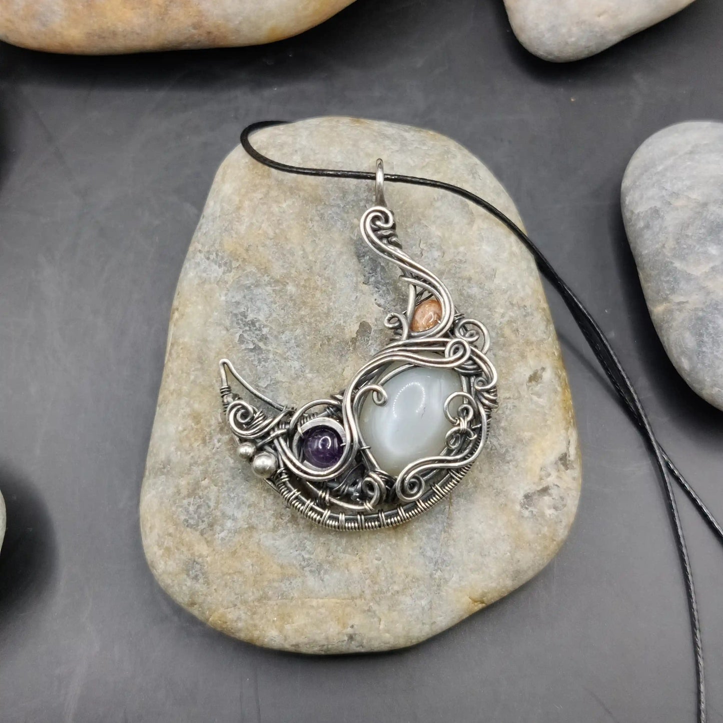 Lusine crescent silver moon pendant with amethyst, white moonstone, and sunstone set in 925 sterling silver handmade by a local artisan.