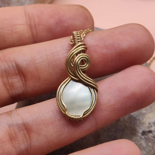 Niyati mother of pearl pendant 005 in brass made by sanguine aura handcrafted jewellery, India 