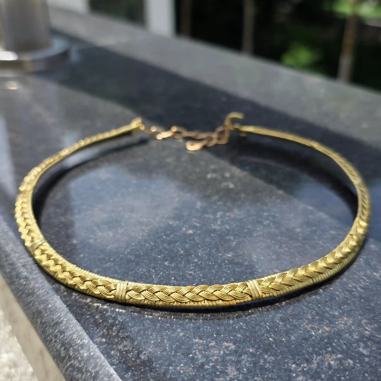 Roopmati handmade brass hasli with braided pattern made by Sanguine Aura Handcrafted Jewellery, India 