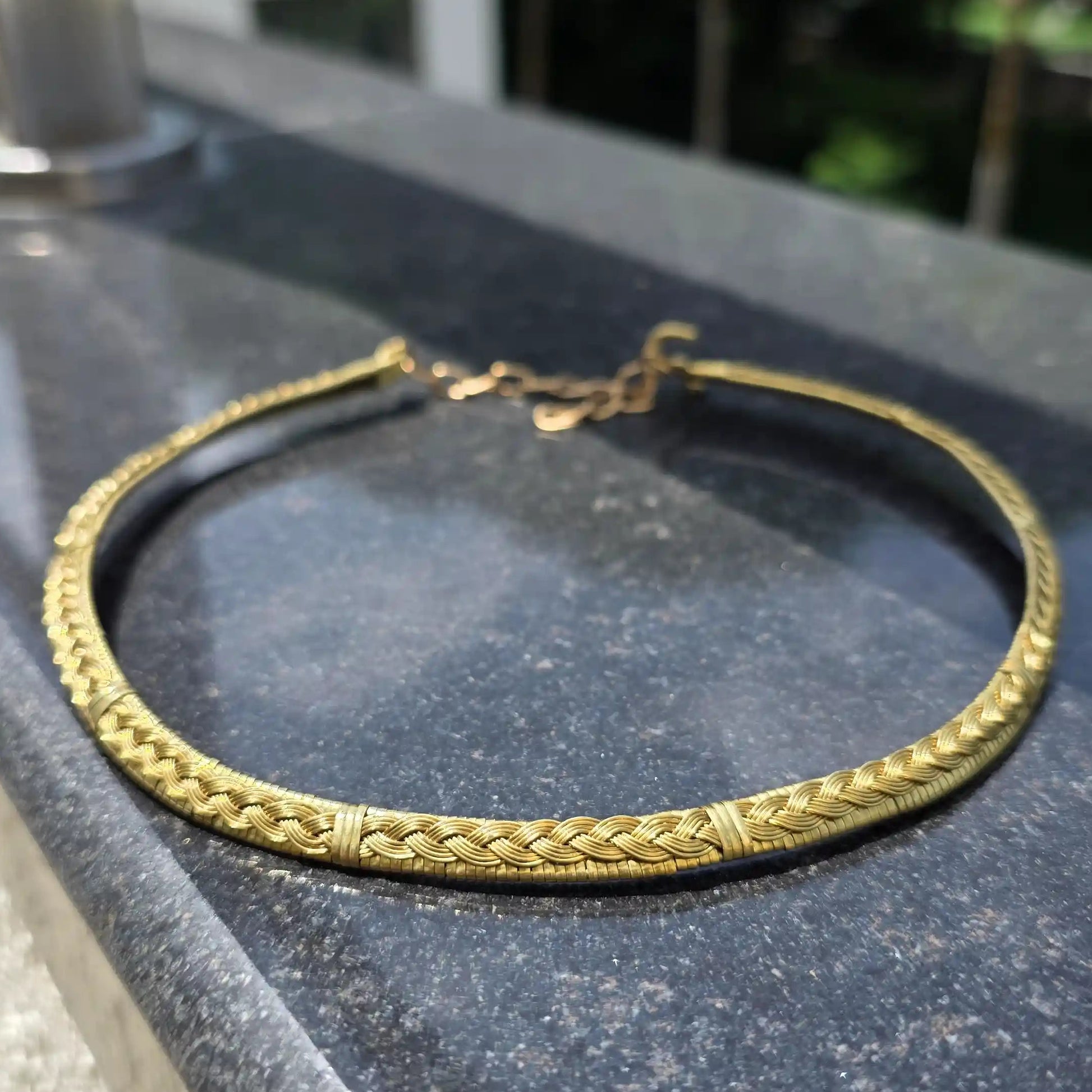 Roopmati handmade brass hasli with braided pattern made by Sanguine Aura Handcrafted Jewellery, India 