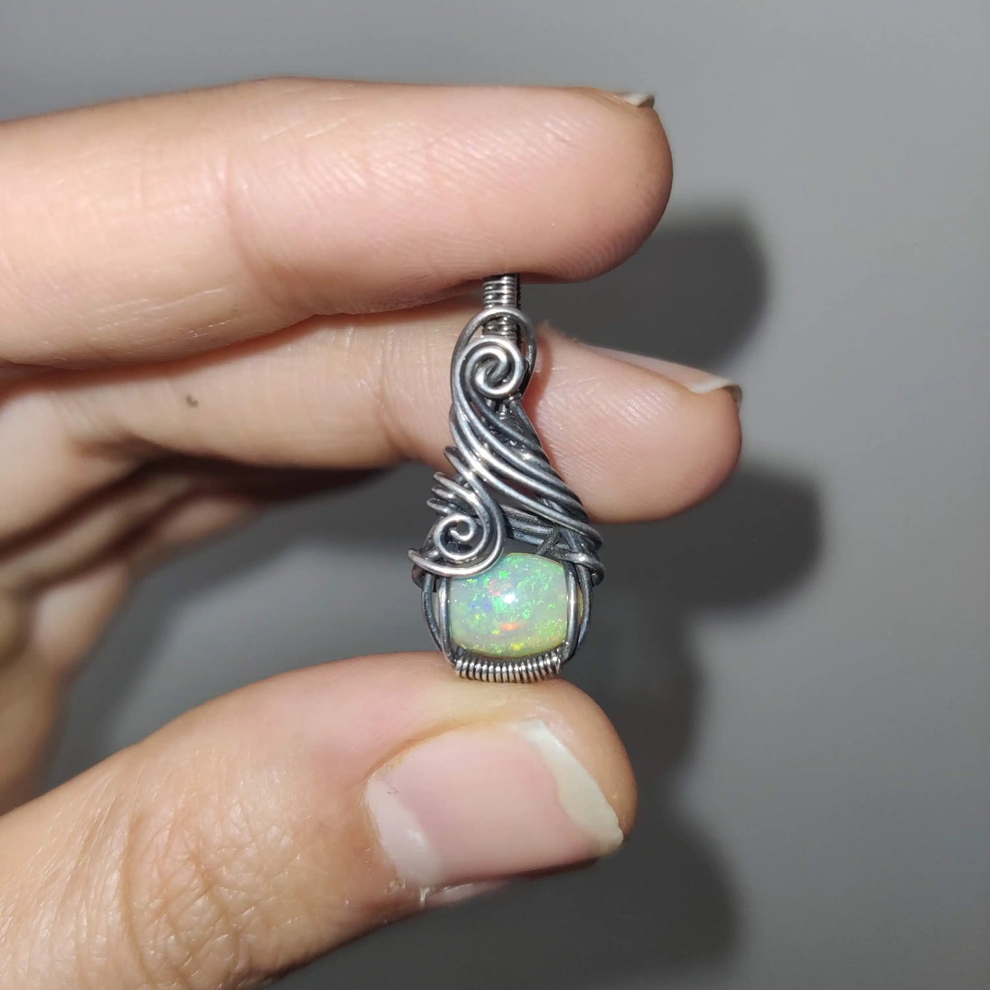 Ethiopian opal fire captured under camera flash of Banno- opal silver pendant made by sanguine aura handcrafted jewelry, India