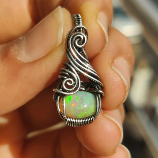 Ethiopian opal fire captured in natural light, of Banno- opal silver pendant made by sanguine aura handcrafted jewelry, India