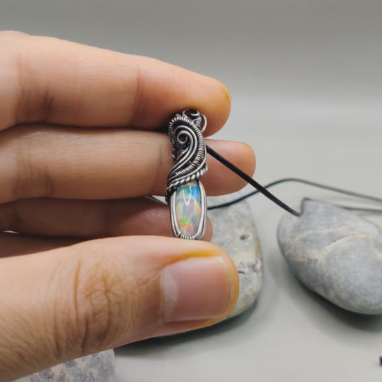 Banno, an Ethiopian opal silver pendant. this pendant has been created by Sanguine Aura.